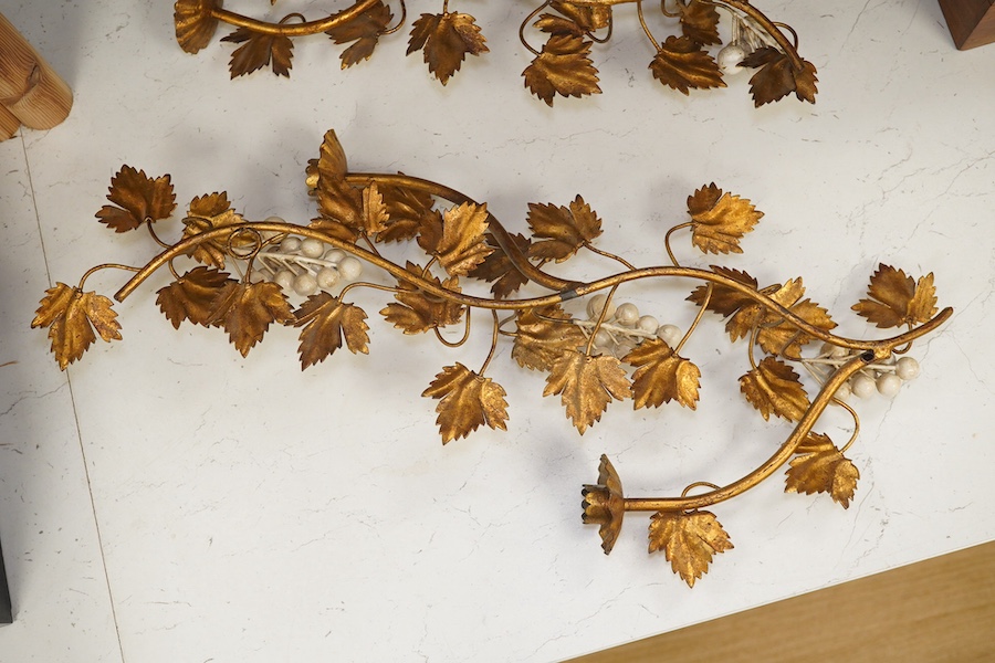 A pair of gilt metal and porcelain ‘white berry’ two branch wall sconces, 55.5cm. Condition - fair to good